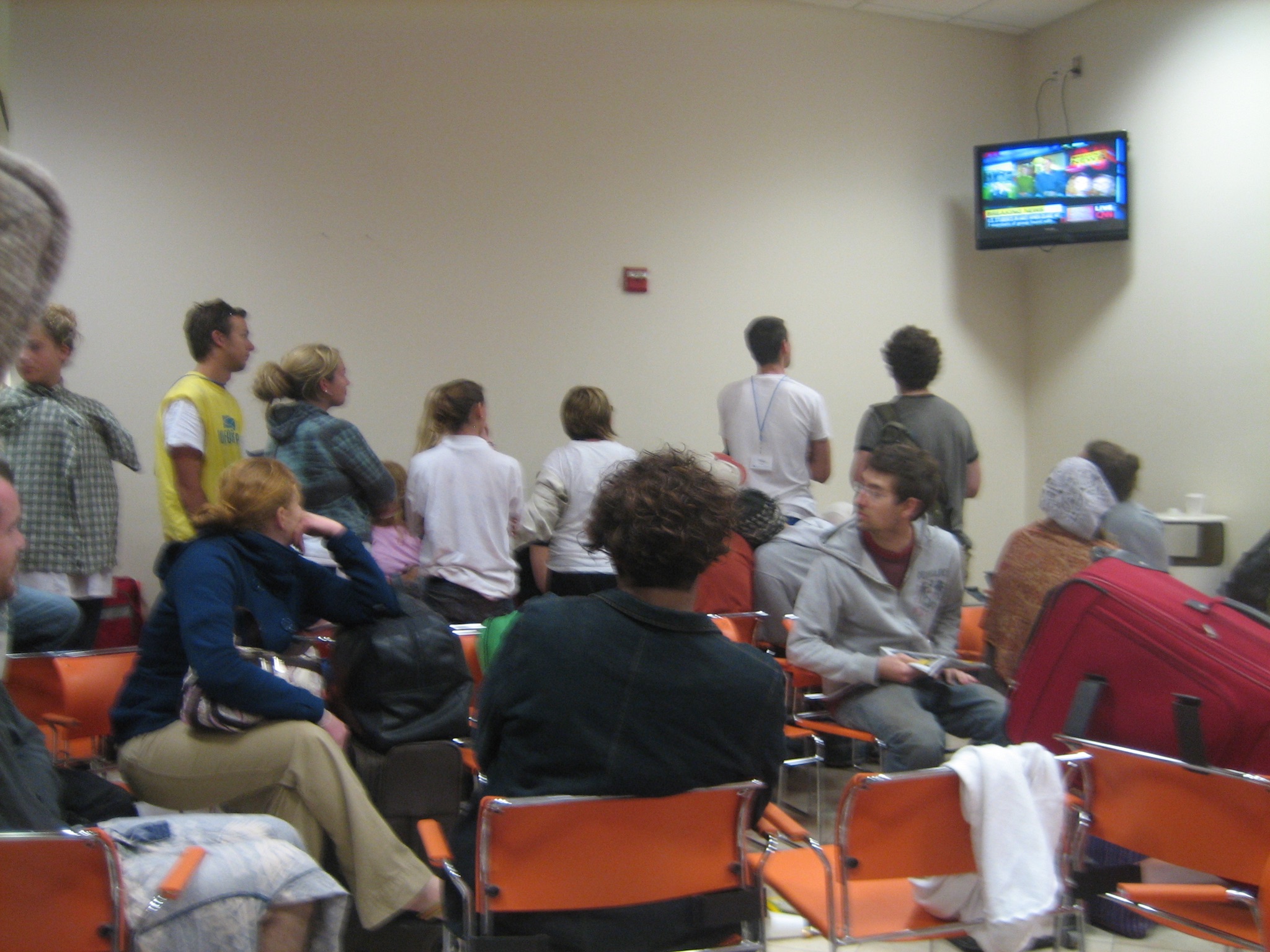 People watch Crisis in Haiti on CNN from the US Embassy. James is the face on the right.